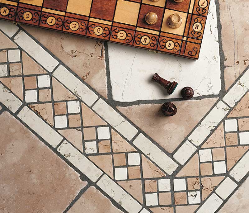 A wooden chessboard sits on premium tile Florida flooring, with three chess pieces placed beside it.
